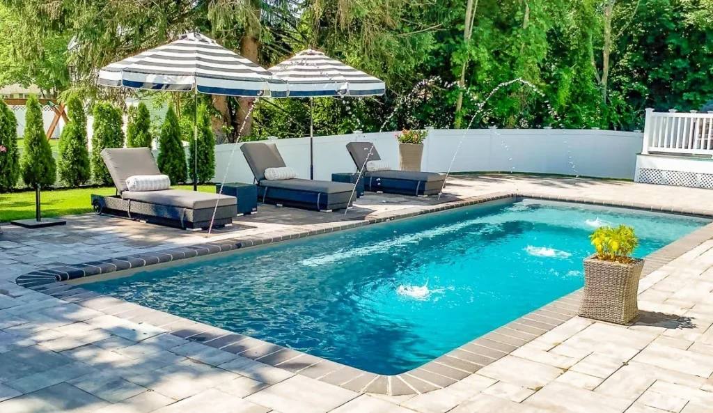 Leisure Reflection with Splash Deck with deck jets and striped umbrellas